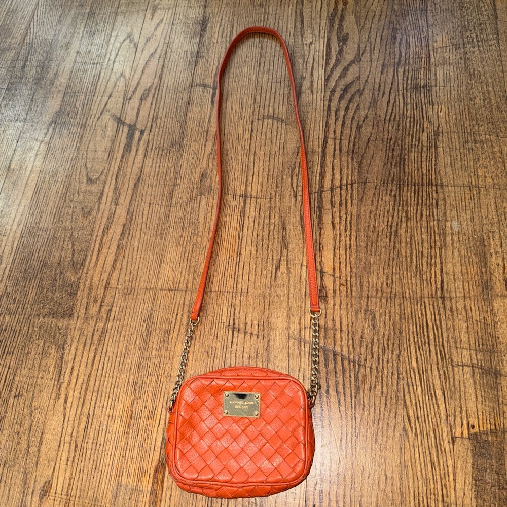 Orange Michael Kors crossbody purse